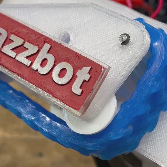 video of track product driven around a set of pulleys to demonstrate its function